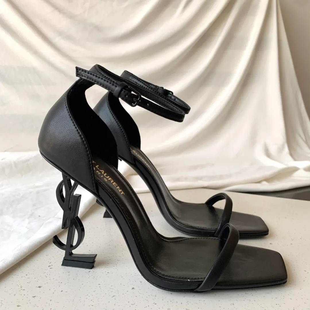 👟👟Ex-factory price 520👟👟 SAINT LAUREN*" Saint Laurent YSL classic one-word high-heeled sandals with logo lettering. Only YSL understands women's hearts best and does not accept refutation. It is a super invincible feminine artifact and a must-have for women (✅Z product full body customization, own molded toe hardware, perfect consistency) Upper: Customized imported cotton silk fabric/imported calf patent leather Inner lining: imported 🐑 sheepskin Sole: imported genuine leather outsole Heel height: 9cm Color: black lacquer with silver, black with gold Size: 35-39 (full set of packaging)